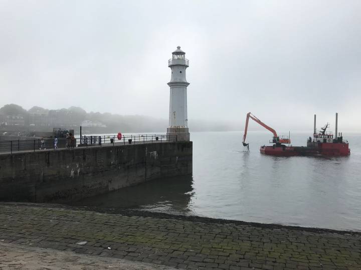 Newhaven harbour and lighthouse with sea fog (haar)